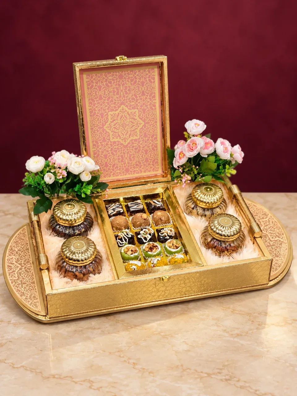 Gold sweet hamper in a styled burgundy setting